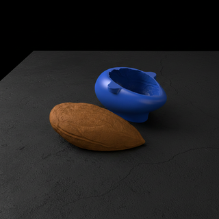 Mandorla e stampo silicone blu vista laterale su cemento nero